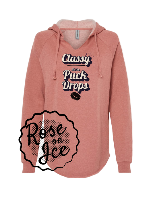 Pink hoodie with text design on a white background