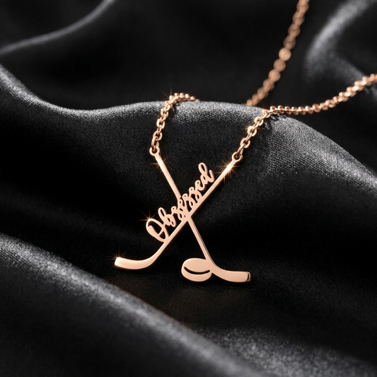 Rose gold necklace with 'Obsessed' pendant on black fabric
